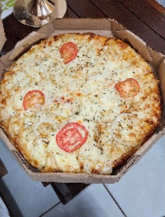 Pizza artesanal na brasa